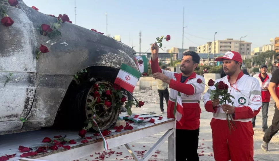 epa12192270 A handout picture provided by the Iranian Red Crescent Society (IRSC) shows members of the organisation placing flowers and petals on the Red Crescent vehicle which was attacked during the Israeli air strike on 19 June, in Tehran, Iran, 23 June 2025. US forces struck three of Iran's key nuclear sites: Natanz, Isfahan and Fordo, US President Trump announced on 21 June. Israel and Iran have been exchanging fire since Israel launched strikes across Iran on 13 June 2025 as part of Operation 'Rising Lion.' EPA/HANDOUT HANDOUT EDITORIAL USE ONLY/NO SALES