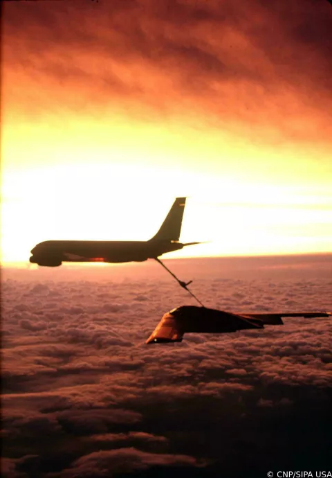 A KC-135 Stratotanker refuels a Northrop B-2 Spirit bomber in the air over an undisclosed location. This photo was released by the United States Department of Defense on September 4, 2002. Credit: United States Department of Defense via CNP/Sipa USA Photo: CNP/SIPA USA