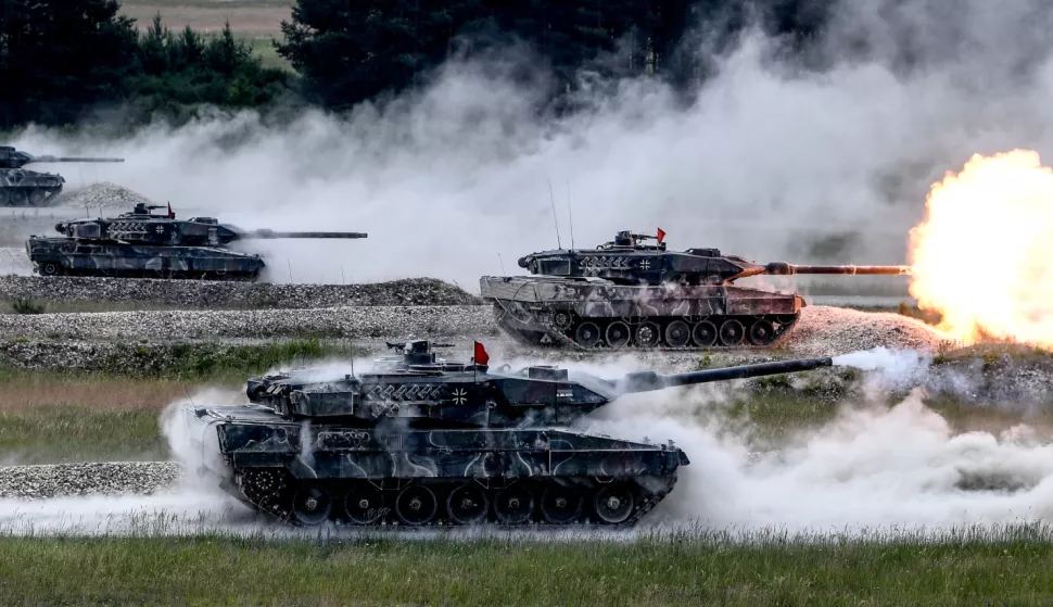 epa06877608 (FILE) - German Army's 'Leopard 2A6' tanks stand on their positions a fire rounds while participating in the 'Strong Europe' Tank Challenge 2018 at the military training area in Grafenwoehr, Germany, 08 June 2018 (reissued 10 July 2018). NATO member countries' heads of states and governments (Belgium, Canada, Denmark, France, Iceland, Italy, Luxembourg, the Netherlands, Norway, Portugal, Britain and the United States) will gather in Brussels, Belgium on 11 and 12 July 2018 for a two days meeting. EPA/FILIP SINGER *** Local Caption *** 54392757