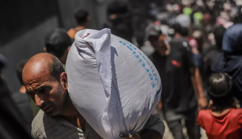 epa12198727 World Food Programme aid packages are distributed after successfully arriving at the organization's warehouses in Gaza City, 26 June 2025. According to the UN half a million people, or one in five people in the Strip are facing starvation while the entire population of the Gaza Strip continues to face a critical risk of famine following 19 months of conflict, mass displacement and severe restrictions on humanitarian aid. EPA/MOHAMMED SABER