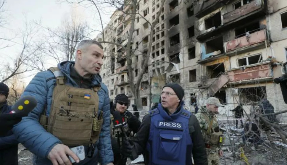 epa09824614 Kyiv's mayor Vitaliy Klitschko speaks with media near the shelled residential building in Kyiv (Kiev), Ukraine, 14 March 2022. Two persons died and three were injured during that shelling. Russian troops entered Ukraine on 24 February prompting the country's president to declare martial law and triggering a series of announcements by Western countries to impose severe economic sanctions on Russia. EPA/SERGEY DOLZHENKO