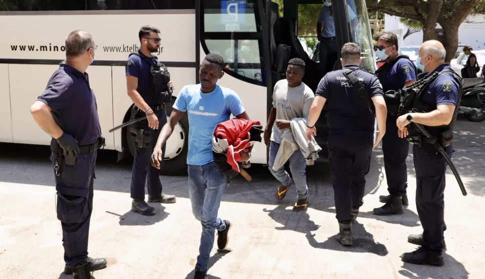 epa12224391 Migrants get off a bus at the port of Heraklion, Crete, Greece, 08 July 2025. The Greek Coast Guard, in collaboration with local authorities, has begun the identification process after at least 116 migrants were spotted at dawn aboard three different boats that successively approached the southern coasts of the prefecture of Heraklion. EPA/NIKOS CHALKIADAKIS
