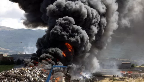 epa12226478 A plume of smoke rises from a fire in a scrap metal dump on the northern outskirts of Skopje, North Macedonia, 09 July 2025. EPA/GEORGI LICOVSKI