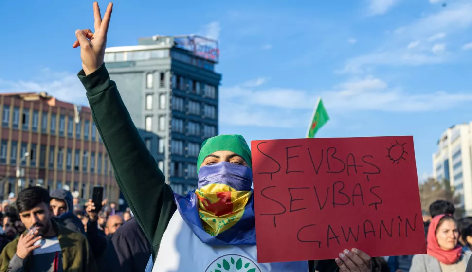 epa11928266 A supporter of Turkish pro-Kurdish Peoples' Equality and Democracy Party (DEM) holds a placards reading 'Good night dear' while gathering with others to watch on a screen a press conference of a DEM delegation following their visit to jailed Kurdistan Workers' Party (PKK) leader Abdullah Ocalan, in Diyarbakir, Turkey, 27 February 2025. At the press conference of the DEM on 27 February, a letter from the imprisoned PKK militant leader was read, in which Abdullah Ocalan called on the Kurdish group to lay down their arms. EPA/STRINGER