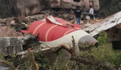epa12172804 Officials inspects site of an airplane crash near Sardar Vallabhbhai Patel International Airport in Ahmedabad, Gujarat, western India, 13 June 2025. Air India flight AI171, bound for London carrying 242 passengers and crew members on board a Boeing 787-8 aircraft, crashed minutes after take-off in the Meghaninagar area of Ahmedabad. EPA/RAJAT GUPTA