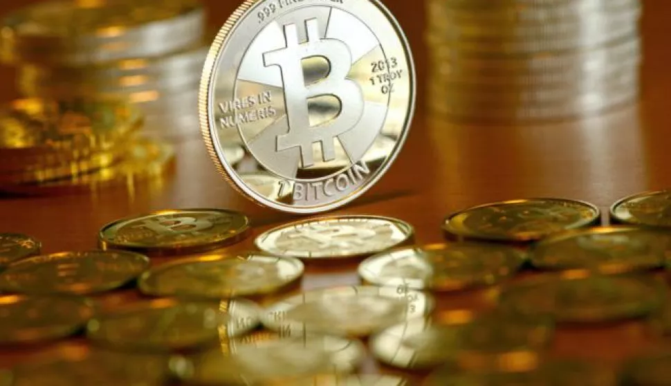 Illustration - A Bitcoin coins pictured at the coin dealer BitcoinCommodities in Berlin, Germany, 28 November 2013. When paying with bitcoin, no actual monetary exchange takes place between buyer and seller. Instead, the buyer requests an update to a public transaction log, the blockchain. Photo: Jens Kalaene | usage worldwide/DPA/PIXSELL------3 st color ekonomija