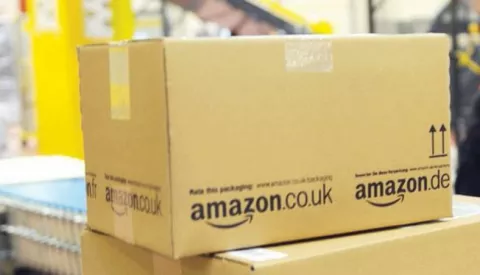 epa04335624 (FILE) A file photo dated 20 December 2010 showing an employee of the online-retailer Amazon putting packages onto a conveyor band at the logistics centre in Bad Hersfeld, Germany. Amazon, the world's biggest online retailer, announced 30 July 2014 that it will invest an additional 2 billion dollars to expand in India, where competition is heating up. The move came a day after Flipkart, India's largest online retailer, announced that it had raised a record 1 billion dollars, the most ever by an Indian internet company in a single round.Amazon said its investment would support its rapid growth and enhance the customer and seller experience in India.Amazon launched its India operations in June 2013. EPA/UWE ZUCCHI