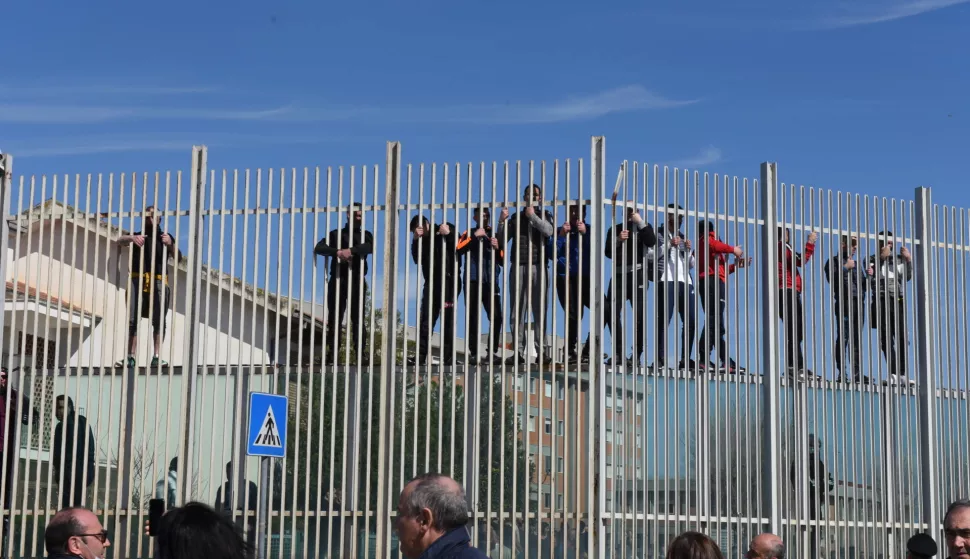 epa08280725 Inmates climb the fence of the detention center during prison riots in Foggia, Apulia region, southern Italy, 09 March 2020. Several inmates in Foggia have reportedly managed to evade after tearing up a gate at the prison's block house and once they reached the road outside where blocked by the police, media reported. Violent protests broke out on the day in 27 Italian prisons against the novel coronavirus restrictions affecting the country with many inmates asking for an amnesty due to the virus emergency. Serious riots are taking place at San Vittore in Milan and Rebibbia in Rome where, as well as burning mattresses, some inmates attacked the infirmaries, media reported. EPA/FRANCO CAUTILLO