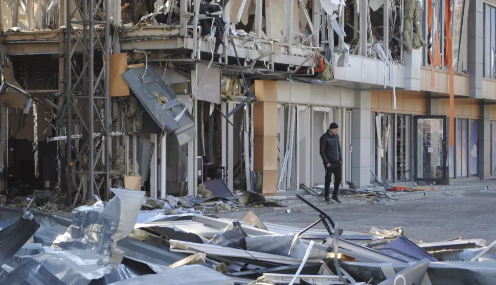 epa11978021 Local people inspect the site of a drone strike in Odesa, southwestern Ukraine, 21 March 2025, amid the Russian invasion. As a result of overnight Russian drone strikes on the Odessa region, at least three people were injured and fires broke out in a shopping center and shops, and a high-rise building was damaged, according to the State Emergency Service of Ukraine (SESU). EPA/IGOR TKACHENKO