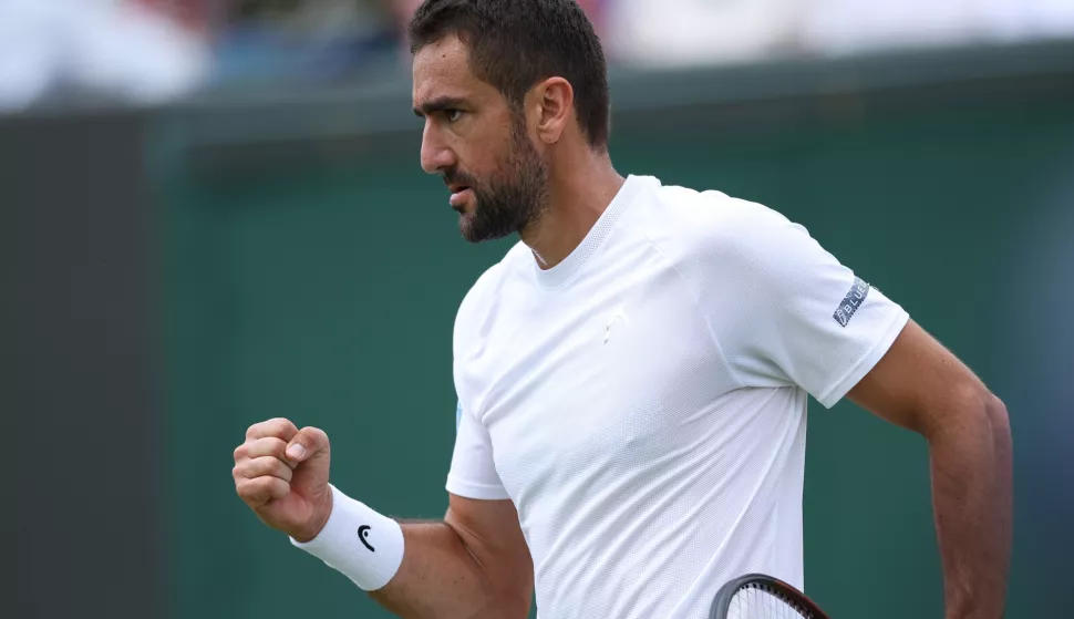 epa12222090 Marin Cilic of Croatia celebrates a point during the Men's Singles Fourth Round match against Flavio Cobolli of Italy at the Wimbledon Championships, Wimbledon, Britain, 07 July 2025. EPA/ADAM VAUGHAN EDITORIAL USE ONLY
