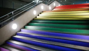 epa12258041 Stairs of the U5 underground station 'Bundestag' are decorated in rainbow colors in Berlin, Germany, 24 July 2025. The Berlin public transportation company BVG has adorned the entrance of the underground station with an LGBTQ+ flag and painted the stairs inside the station in rainbow colors on the occasion of the upcoming Christopher Street Day (CSD). An earlier decision of Bundestag President Julia Kloeckner not to fly the rainbow flag during the CSD celebrations over the Bundestag, the seat of the German parliament, drew criticism. EPA/CLEMENS BILAN