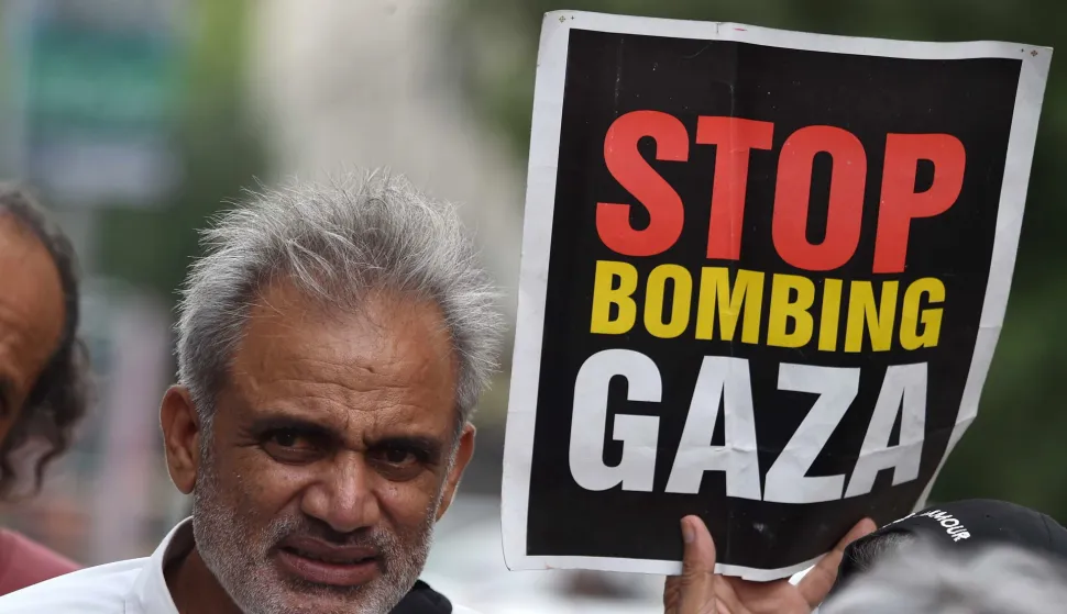 epa12261105 A civil society activist holds a placard during a rally in solidarity with the Palestinian people, amidst the ongoing conflict in Gaza, in Karachi, Pakistan, 25 July 2025. At least 113 Palestinians, including more than 80 children, have died due to famine and malnutrition in the Gaza Strip, according to the Palestinian Ministry of Health. EPA/SHAHZAIB AKBER
