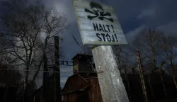 epa11856845 A sign reads 'Stop!' at the area of the former Auschwitz camp in Oswiecim on the 80th anniversary of the liberation of the German Nazi concentration and extermination camp Auschwitz-Birkenau, in Oswiecim, Poland, 27 January 2025. The largest of the German Nazi death camps, KL Auschwitz-Birkenau, was liberated by the Soviet Red Army on 27 January 1945. The world commemorates its liberation by observing International Holocaust Remembrance Day annually on 27 January. EPA/LESZEK SZYMANSKI POLAND OUT