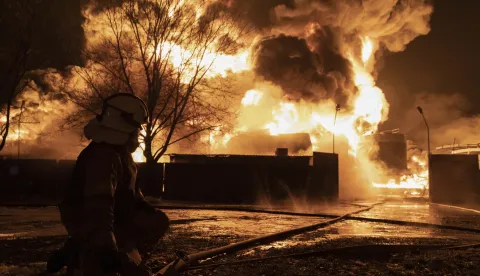 epa11142858 Firefighters work at the site of a fire after a drone strike on a oil depot in Kharkiv, northeastern Ukraine, 10 February 2024, amid the Russian invasion. At least seven people were killed, including three children, due to a fire after Russian shelling on the Nemyshlyan district of Kharkiv overnight 10 February, the chief of the local administration Oleh Syniehubov wrote on telegram. EPA/YAKIV LIASHENKO