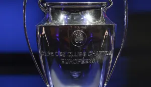 epa09430462 The Champions League trophy is on display during the UEFA Draw and Awards Ceremony at the Halic Congress Center in Istanbul, Turkey, 26 August 2021. EPA/TOLGA BOZOGLU