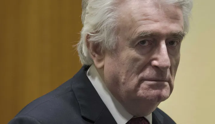 epa07450757 Former Bosnian Serb leader Radovan Karadzic enters the court room of the International Residual Mechanism for Criminal Tribunals in The Hague, Netherlands, 20 March 2019. Nearly a quarter of a century since Bosnia's devastating war ended, Karadzic is set to hear the final judgment on whether he can be held criminally responsible for unleashing a wave of murder and destruction. United Nations appeals judges will on Wednesday rule whether to uphold or overturn Karadzic's 2016 convictions for genocide, crimes against humanity and war crimes, as well as his 40-year sentence. EPA/PETER DEJONG/POOL