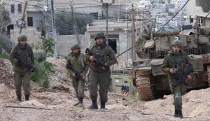 epa11921365 Israeli soldiers in action during a military operation inside the Jenin refugee camp, West Bank, 24 February 2025. The Israeli military launched a military operation in Jenin and its camp on 21 January, resulting in at least 27 Palestinian deaths and dozens of injuries, according to the Palestinian Ministry of Health. EPA/ALAA BADARNEH