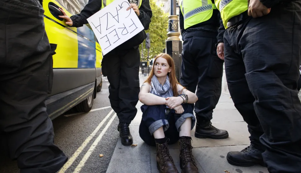 epa12291361 Police officers arrest a supporter of Palestine Action attending a mass protest organized by the Defend Our Juries group as part of their campaign to end the proscription of Palestine Action, in Parliament Square, London, Britain, 09 August 2025. Palestine Action group was banned under terrorism law in the UK after activists allegedly broke into RAF Brize Norton military base in Oxfordshire in June 2025 and caused about 7 million GBP damage to British military planes. EPA/TOLGA AKMEN