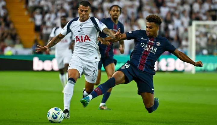 epa12298766 Tottenham Hotspur?s Pedro Porro in action against Desire Doue of PSG (R) during the 2025 UEFA Super Cup final soccer match between Paris Saint-Germain and Tottenham Hotspur in Udine, Italy, 13 August 2025. EPA/Alessio Marini