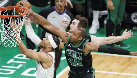 epa12101359 Boston Celtics center Luke Kornet (C) and Boston Celtics center Al Horford (R) block the shot of New York Knicks guard Josh Hart (L) during the third quarter the Eastern Conference Semifinals game five between the Boston Celtics and the New York Knicks in Boston, Massachusetts, USA, 14 May 2025. The New York Knicks lead the best of seven series 3-1. EPA/CJ GUNTHER SHUTTERSTOCK OUT