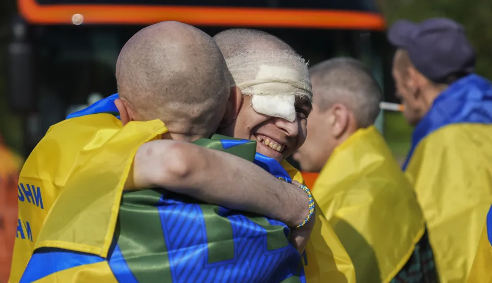 epa12168287 Ukrainian prisoners of war (POWs) react following a prisoner swap at an undisclosed location, Ukraine, 10 June 2025, amid the Russian invasion.This is the first stage of the return of seriously wounded and injured soldiers from Russian captivity, Ukrainian President Volodymyr Zelensky wrote in his official Telegram channel. The agreement on a POW exchange was reached after recent Russia-Ukraine talks held in Turkey. EPA/STRINGER