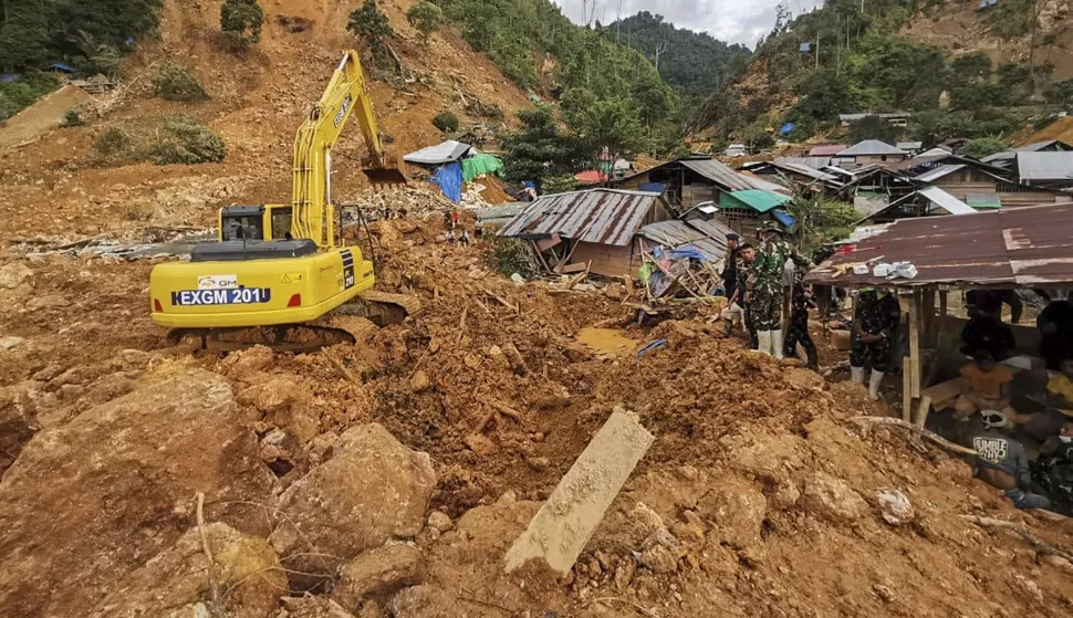 epa11469741 A handout photo made available by the Indonesian Rescue Agency (Basarnas) shows rescuers searching for lanslide victims in Tulabo village, Samawa, Gorontalo, Indonesia, 10 July 2024. According to Basarnas, at least 23 people were killed and 32 went missing after heavy rain triggered landslides in Sulawesi Island. EPA/BASARNAS/HANDOUT HANDOUT EDITORIAL USE ONLY/NO SALES