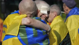 epa12168287 Ukrainian prisoners of war (POWs) react following a prisoner swap at an undisclosed location, Ukraine, 10 June 2025, amid the Russian invasion.This is the first stage of the return of seriously wounded and injured soldiers from Russian captivity, Ukrainian President Volodymyr Zelensky wrote in his official Telegram channel. The agreement on a POW exchange was reached after recent Russia-Ukraine talks held in Turkey. EPA/STRINGER