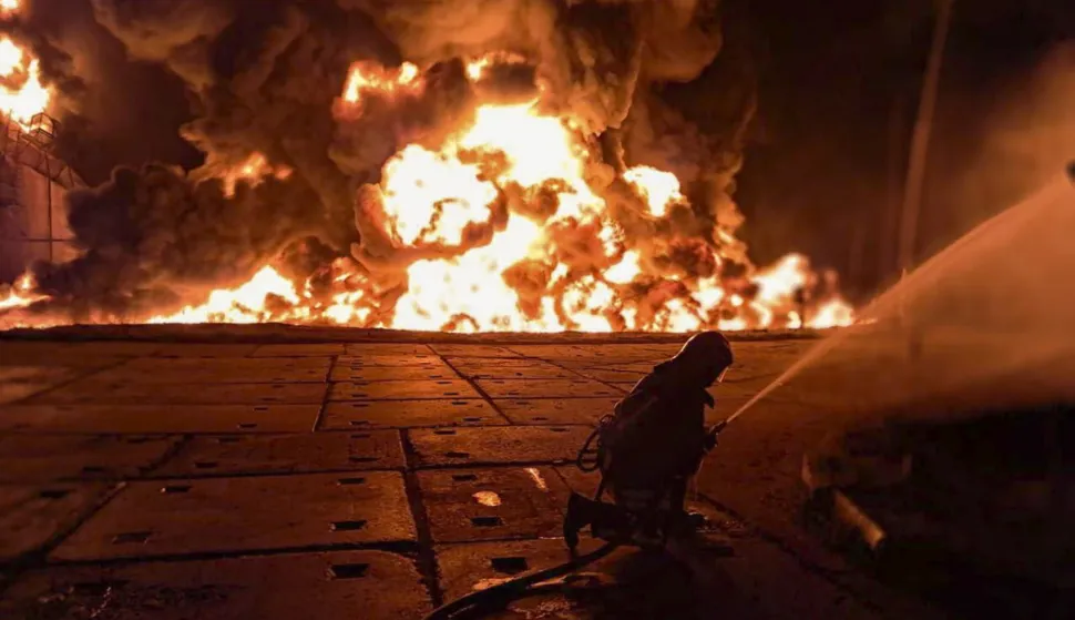 epa12311820 A handout photo provided by the State Emergency Service shows Ukrainian rescuers working at the site of a Russian strike on an infrastructure facility near Odesa, Ukraine, 18 August 2025 (issued 20 August 2025), amid the ongoing Russian invasion. At least one person was injured in a large fire at a fuel and energy infrastructure site, according to the State Emergency Service. EPA/STATE EMERGENCY SERVICE HANDOUT HANDOUT HANDOUT EDITORIAL USE ONLY/NO SALES