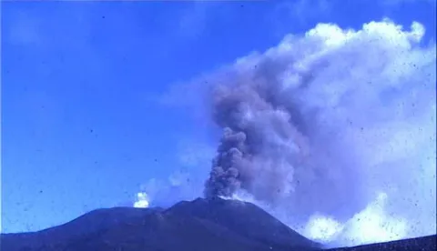 epa06971148 A handout photo made available by the Etna Observatory (Osservatorio Etneo) of the National Institute of Geophysics and Volcanology (INGV-OE) shows a frame grab taken from a monitoring webcam showing Mount Etna spewing ash and erupting lava, in Catania, southern Italy, 24 August 2018. According to INGV, Mount Etna has started new Strombolian activity and emission of lava flows between 23 and 24 August 2018. No evacuations were immediately reported for the towns on the volcano's slopes. EPA/INGV-OE HANDOUT HANDOUT EDITORIAL USE ONLY/NO SALES
