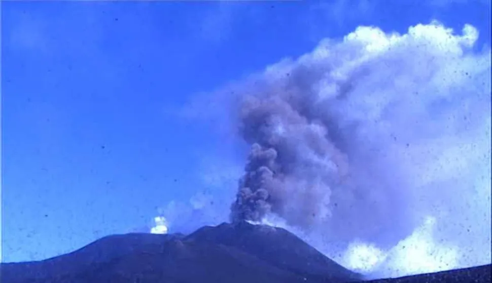 epa06971148 A handout photo made available by the Etna Observatory (Osservatorio Etneo) of the National Institute of Geophysics and Volcanology (INGV-OE) shows a frame grab taken from a monitoring webcam showing Mount Etna spewing ash and erupting lava, in Catania, southern Italy, 24 August 2018. According to INGV, Mount Etna has started new Strombolian activity and emission of lava flows between 23 and 24 August 2018. No evacuations were immediately reported for the towns on the volcano's slopes. EPA/INGV-OE HANDOUT HANDOUT EDITORIAL USE ONLY/NO SALES