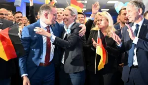 epa11918944 Alternative for Germany (AfD) party and faction co-chairwoman and top candidate for the federal election, Alice Weidel (C) reacts to initial results next to AfD co-chairman Tino Chrupalla (L) during the party's election event at its headquarters in Berlin, Germany, 23 February 2025. About 60 million Germans were eligible to vote in the elections for a new federal parliament (Bundestag). EPA/SOEREN STACHE/POOL Stadt aktualisiert