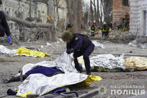 epa12029026 GRAPHIC CONTENT - A handout photo made available by the National Police of Ukraine shows a police officer inspecting the bodies of the victims at the site of a rocket strike in downtown Sumy, Ukraine, 13 April 2025, amid the ongoing Russian invasion. At least 31 people were killed, including two children, and 84 people were injured, including 10 children, after a Russian rocket hit downtown Sumy in the morning, according to a report by the State Emergency Service. EPA/NATIONAL POLICE OF UKRAINE HANDOUT -- ATTENTION EDITORS: GRAPHIC CONTENT -- HANDOUT EDITORIAL USE ONLY/NO SALES