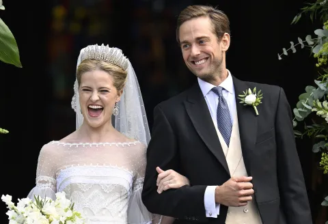 epa12336054 Princess Marie Caroline of Liechtenstein (L) and Leopoldo Maduro Vollmer react as they depart the St. Florin Cathedral following their wedding ceremony in Vaduz, Liechtenstein, 30 August 2025. EPA/WALTER BIERI