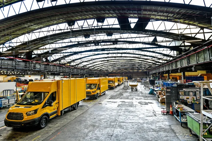 epa07080969 New electric transporters sit in line on the StreetScooter Work XL production line of the US car manufacturer's plant Ford in Cologne-Niehl, Germany, 09 October 2018. The Series production of the StreetScooter Work XL electric transporter, which Ford produces in partnership with StreetScooter GmbH, a subsidiary of Deutsche Post DHL Group, begins at the Ford plant in Cologne-Niehl. EPA/SASCHA STEINBACH