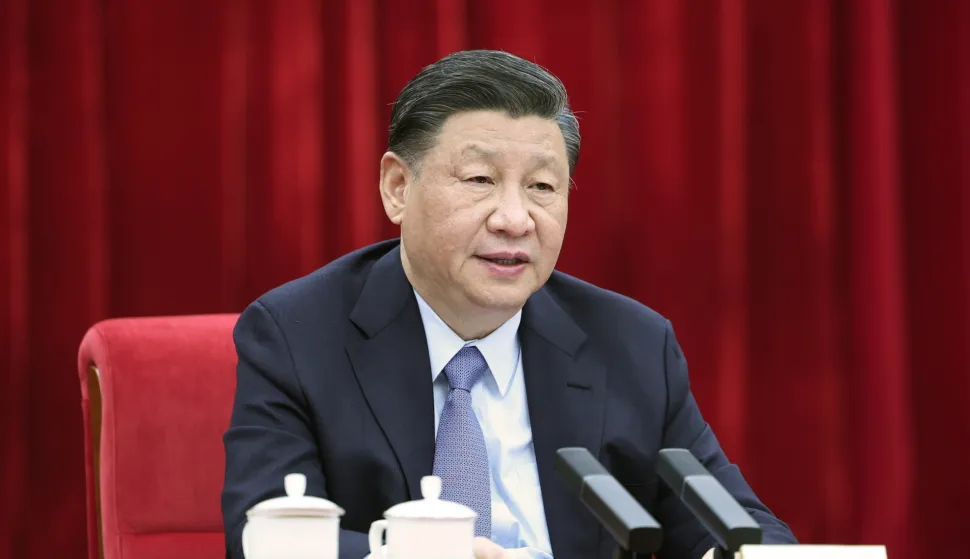 epa10506434 Xi Jinping, China's President, General Secretary of the Communist Party of China Central Committee and Chairman of the Central Military Commission, looks on while listening to the national political advisors from the China National Democratic Construction Association and the All-China Federation of Industry and Commerce, who are attending the first session of the 14th National Committee of the Chinese People's Political Consultative Conference (CPPCC), in Beijing, China, 06 March 2023. President Xi participated in their joint group meeting, and listened to their comments and suggestions. EPA/XINHUA/Ju Peng CHINA OUT/MANDATORY CREDIT EDITORIAL USE ONLY