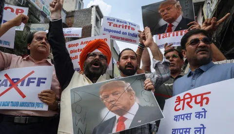 epa12335824 Members of the Federation of Sadar Bazar Trades Association (FESTA) protest against the US at Sadar Bazar wholesale market in New Delhi, India, 30 August 2025. The 50 percent tariffs imposed on India by the United States came into effect on 27 August 2025. EPA/RAJAT GUPTA