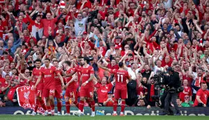 epa12058952 Mohamed Salah of Liverpool celebrates with fans after scoring his team's fourth goal during the English Premier League soccer match between Liverpool FC and Tottenham Hotspur, in Liverpool, Britain, 27 April 2025. EPA/ADAM VAUGHAN EDITORIAL USE ONLY. No use with unauthorized audio, video, data, fixture lists, club/league logos, 'live' services or NFTs. Online in-match use limited to 120 images, no video emulation. No use in betting, games or single club/league/player publications.