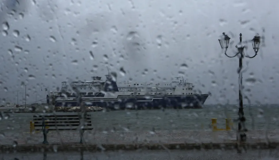 epa07054001 An anchored ship is seen through a car's window, at the port of Rafina, near Athens, Greece, 28 September 2018. Greece's civil protection services announced that authorities are on full alert ahead of the arrival of a tropical-like cyclone expected in the next few hours as they warned the public to expect winds between 80 and 100kph (9-10 Beaufort) with heavy rain and storms, especially in the southern Peloponnese, Crete and western Cyclades islands. EPA/YANNIS KOLESIDIS