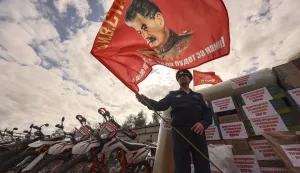 epa12361943 A Russian serviceman holds a red flag with a portrait of Soviet leader Josef Stalin during the send-off of the 143rd humanitarian convoy organized by the Russian Communist Party for the Russian army and residents of the Kursk, Donetsk and Luhansk regions, at the Lenin State Farm outside Moscow, Russia, 08 September 2025. The convoy is dedicated to the 80th anniversary of the Red Army?s victory over Japan and the end of World War II in 1945. It contains food, medicine, drones and hundreds of motocross motorcycles, which are used by the military on the front line for assault operations. EPA/SERGEI ILNITSKY