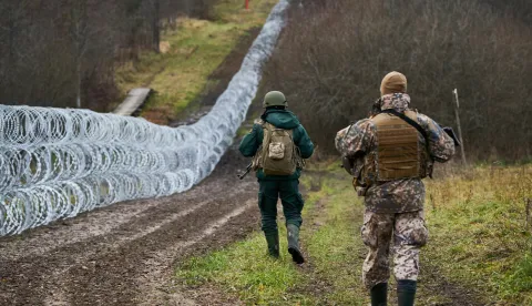 epa09587831 A handout photo made available by Latvian Prime Minister's office shows Latvian Army soldier (R) and Latvian Border guard (L) patrolling along the border during Latvia's Prime Minister Krisjanis Karis (not seen) unannounced visit to Latvian and Belarus border in Silene, Latvia, 17 November 2021. Krisjanis Karins met the border guards and soldiers of the National Armed Forces, who are currently guarding the Latvian-Belarusian border. EPA/LATVIAN PRIME MINISTER OFFICE HANDOUT HANDOUT EDITORIAL USE ONLY/NO SALES