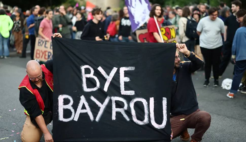 Protesters hold a banner which reads "Bye Bayrou" as they gather for a "Bayrou's farewell party" protest in front of the city hall in Nantes after French Prime Minister Francois Bayrou failed to secure a majority from MPs in a confidence vote during an extraordinary session at the National Assembly, France, September 8, 2025. REUTERS/Stephane Mahe Photo: STEPHANE MAHE/REUTERS
