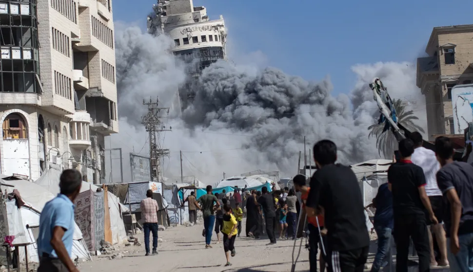 epaselect epa12362349 Palestinians react as the al-Roya residential building is hit by an Israeli airstrike in the west of Gaza City, Gaza Strip, 08 September 2025. Israel confirmed the strike, claiming the building was housing 'intelligence gathering means'. EPA/HAITHAM IMAD