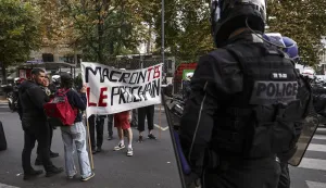 epa12362938 Police officers block a group of people carrying a banner reading 'Macron, you're next' during a spontaneous rally following the rejection of the vote of confidence requested for Prime Minister François Bayou, in Montreuil, Paris, France, 08 September 2025. French Prime Minister Francois Bayrou has lost the vote of confidence after he activated Article 49.1 of the Constitution. EPA/TERESA SUAREZ