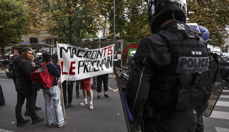 epa12362938 Police officers block a group of people carrying a banner reading 'Macron, you're next' during a spontaneous rally following the rejection of the vote of confidence requested for Prime Minister François Bayou, in Montreuil, Paris, France, 08 September 2025. French Prime Minister Francois Bayrou has lost the vote of confidence after he activated Article 49.1 of the Constitution. EPA/TERESA SUAREZ