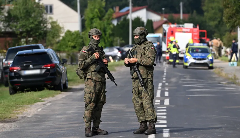 epa12366592 Polish Army and emergency services inspect the site after a Russian drone damaged the roof of a residential building in Wyryki, eastern Poland, 10 September 2025. Russian drones repeatedly violated Polish airspace overnight. EPA/WOJTEK JARGILO POLAND OUT