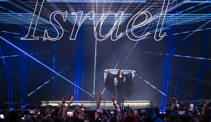 epa12111126 Israel's Yuval Raphael takes part in the flag parade during the final at the 69th Eurovision Song Contest in Basel, Switzerland, 17 May 2025. EPA/GEORGIOS KEFALAS