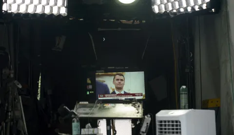 epa12368488 A television showing the image of Charle Kirk at Pebble Beach at the White House, Washington DC, USA, 10 September 2025. Activist and Founder and President of Turning Point Action, Charlie Kirk was shot and killed at Utah Valley University in Utah earlier today. EPA/WILL OLIVER