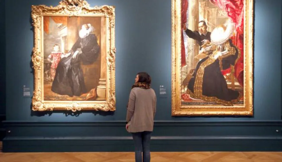 Rubens exhibition - LondonA visitor gazes at Van Dyck's work 'A Genoses Noblewoman and her Son' (left) hung along side Rubens' work 'Portrait of Maria Grimaldi and Dwarf' during a press preview of the 'Rubens and his Legacy:Van Dyck to Cezanne' exhibition at the Royal Academy of Arts, London.Jonathan Brady Photo: Press Association/PIXSELL------ZADNJA2 ST