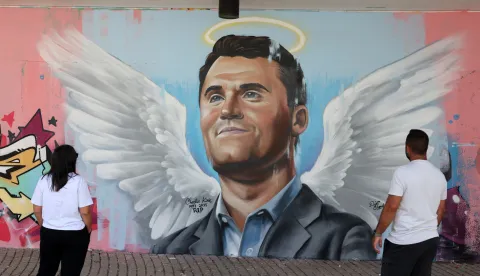 epaselect epa12370549 People look at a mural honouring slain US conservative political activist Charlie Kirk, in Ashdod, Israel, 12 September 2025. Kirk, 31, was shot dead while speaking at Utah Valley University on 10 September 2025. EPA/ABIR SULTAN