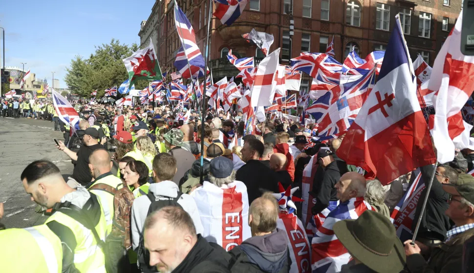 epa12372865 Supporters of 'Unite the Kingdom' protest march gather in central London, Britain, 13 September 2025. Two opposing demonstrations are being held simultaneously in London: one led by Tommy Robinson, called 'Unite the Kingdom,' and another by 'Stand Up to Racism.' EPA/TAYFUN SALCI